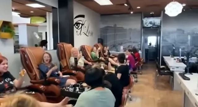 Guests relaxing in the pedicure chairs during a group pamper party