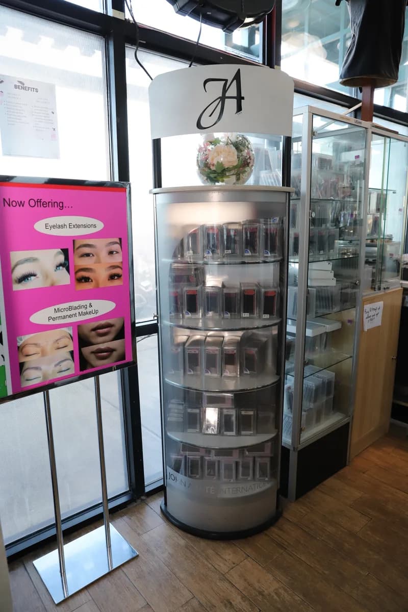 Lash aftercare products and skincare on display at the front of the salon.